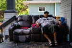Lionel Irving sits on his porch on July 1, 2019, in North Portland, Oregon. Irving is trying to interrupt the cycle of violence in his community that led him to join a gang at a young age.