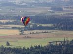It's a hot weekend for outdoor activities such as ballooning. The La Jolla, piloted by Dale Justice of Newberg, prepares to touch down on the first morning of the 38th Annual Tigard Festival of Balloons on Friday, June 24, 2022. 