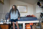 Jeff Zumwalt, 68 years old, gets up from his bed in Opportunity Village in West Eugene, Aug. 31, 2023. Zumwalt was one of the first villagers to move to the new site because of his various health issues that prevent him from working.