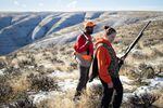 Kyle Thompson, left, and Lindsay Ober take a break on a chukar hunting trip in Sherman County on Dec. 12, 2022. 