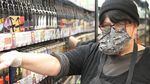 Patty Beavers wears protective gear at Green Zebra grocery in southeast Portland, “I’m just grateful that I’m able to work right now. … Just hang in there, be clean, be safe, this will pass. It always has and it will.”