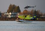 A de Havilland Beaver floatplane converted to electric battery-powered propulsion prepares to land on the Fraser River in Richmond, British Columbia.