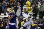Oregon wide receiver Mycah Pittman, left, and wide receiver Devon Williams, right, celebrate a touchdown reception by Williams during the first half of a NCAA college football game against Washington, Saturday, Nov. 6, 2021, in Seattle.