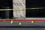 Evidence markers outside Big Lots in Bend, Ore., Monday, Aug. 29, 2022. A gunman opened fire at the store and neighboring Safeway, killing at least two people Sunday.