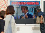 A screen broadcasts news of the shooting of former Japanese Prime Minister Shinzo Abe on Friday in Tokyo.