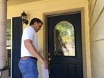 Ben Straka with the Freedom Foundation knocks on doors as part of the group's canvassing efforts. The foundation is urging public employees to opt out of paying union dues.