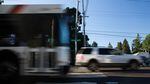Cars and a TriMet bus drive down Southeast Division Street at 157th Avenue in Portland, Oregon, Wednesday, July 11, 2018.