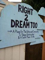 A sign welcomes visitors to the Right 2 Dream, Too homeless camp in Portland, Oregon.