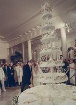 Tricia Nixon cuts into her wedding cake with her husband, Edward Cox, on June 12, 1971.
