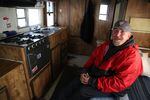 George Discuillo keeps warm in his RV right outside of Sisters, Ore. 