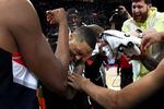 Portland Trail Blazers guard Damian Lillard, center, is doused by teammates after setting franchise and career highs with 71 points during an NBA basketball game against the Houston Rockets in Portland, Ore., Sunday, Feb. 26, 2023.