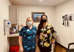 Orchid Heath McKenzie River Clinic's Medical Assistant Shawn DuFault (left) and Community Health Worker, Daisy Cruz, hold down the health care fort. They say they love their patients.