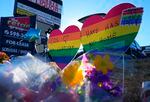 A makeshift display of bouquets of flowers are on display on a corner near the site of a weekend mass shooting at a gay bar, Monday, Nov. 21, 2022, in Colorado Springs, Colo.