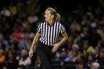 FILE - Referee Dee Kantner works in the second half of an NCAA college basketball game between Tennessee and Vanderbilt Monday, Jan. 5, 2015, in Nashville, Tenn. Kantner, a veteran referee of women’s games who works for multiple conferences, finds it frustrating to have to justify equal pay. “If I buy an airline ticket and tell them I’m doing a women’s basketball game they aren’t going to charge me less,” she said.