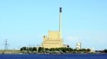 A power plant with tall chimney