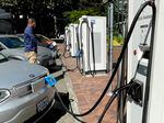 JR Anderson, program manager for Forth, views charging stations in Portland's Electric Avenue, Sept. 8, 2022. Anderson recently bought a 2022 Chevy Bolt and says it is one of the more affordable EVs, qualifying for both the federal and state rebates.