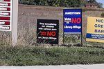 Signs urged local voters to vote "no" and defund the Patmos Library in Jamestown Township, Mich., after some residents objected to books they thought were inappropriate for young readers. The "no" votes prevailed, and the library says without the tax dollars, it may have to close.