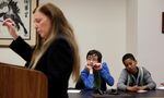 In this Nov. 22, 2016 file photo, petitioners Gabe Mandell, 14, center, and Adonis Williams, 12, look on as state Department of Ecology attorney Katharine G. Shirey speaks at a court hearing in Seattle.