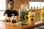 Portia Mittens, co-owner of Sumpter's second dispensary The Coughie Pot, shows off some of her products. 