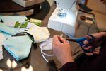 Aurora Oliva Ma of Beaverton, Ore., sews DIY protective face masks using materials purchased from JoAnn Fabrics at her home on March 19, 2020. Oregon Health & Science University officials say, for now, they are researching effective materials and sewing patterns people could use to sew masks for them.