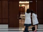 Tracey Wilkinson (left), a pediatric doctor with Indiana University School of Medicine, and Caroline E. Rouse, a maternal fetal medicine doctor with IU School of Medicine, line up outside of a conference room to support Caitlin Bernard during Thursday's hearing.
