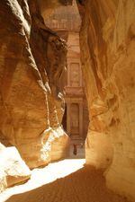 This narrow slot canyon, known as "The Shaft," is the main entrance to the ancient city of Petra in Jordan.
