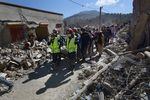 Rescue teams and civil protection members search the rubble for bodies of victims that perished in the devastating earthquake in Imi N'Tala, Morocco, on Sept. 13.