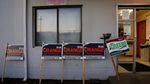 Campaign signs for Port of Vancouver Commissioner race outside the ILWU building in downtown Vancouver. 