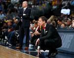 Trail Blazer coach Terry Stotts kneels during a playoff game in Portland, Oregon.