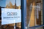 A handmade closed sign taped to the window of one of Portland, Oregon's busiest restaurants, Screen Door. Their brunch and dinner lines usually stretch out the door and spill onto the sidewalk. On Monday, March 16, 2020, Gov. Kate Brown ordered restaurants and bars to stop all on-site dining and limit food sales to takeout and delivery service only to help prevent the spread of the new coronavirus.