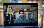 Ramon Hernandez, a student at the University of Oregon, poses for a portrait from his dorm room in Eugene, Ore., on a Zoom video call on Thursday, April 16, 2020. The University of Oregon, like all public universities in the state, has moved to remote learning amid the coronavirus pandemic.