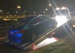 A suspected street racer is towed by Portland Police during an enforcement mission Sunday night.