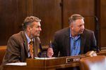 State Sens. Dennis Linthicum, R-Klamath Falls, and Herman Baertschiger Jr., R-Grants Pass, talk on the Senate floor at the Capitol in Salem, Ore., Thursday, April 11, 2019.