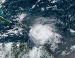 A satellite image shows Tropical Storm Fiona in the Caribbean on Saturday. Fiona threatened to dump up to 16 inches of rain in parts of Puerto Rico as forecasters placed the U.S. territory under a hurricane watch and people braced for potential landslides, severe flooding and power outages.