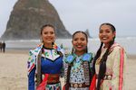 From left to right: Sunni Begay, Erin Tapahe, and Dion Tapahe before Cannon Beach's iconic landmark, Haystack Rock.  The dancers visited the site on July 10, 2021 as part of their Pacific Northwest tour.