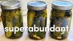 Three jars of homemade pickles.