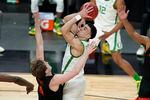 Oregon's Chris Duarte (5) shoots over Oregon State's Zach Reichle (11) during the second half of an NCAA college basketball game in the semifinal round of the Pac-12 men's tournament on March 12.