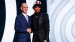 Shaedon Sharpe, right, shakes hands with NBA Commissioner Adam Silver after being selected seventh overall by the Portland Trail Blazers in the NBA basketball draft, Thursday, June 23, 2022, in New York.