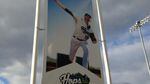 A Hillsboro Hops banner is displayed outside the stadium before the home opener.