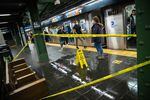 A flooded floor is blocked off in the 42nd Street Times Square subway station during a rain storm in New York, U.S., on Tuesday, Oct. 26, 2021. New York City commuters face a blustery, soaked-to-the-skin trek to work Tuesday as a powerful coastal storm unwinds across the Northeast.