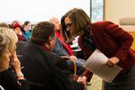 Oregon Gov. Kate Brown shakes hands with Oregon Education Association President John Larson after testimony on House Bill 2019 before the Joint Committee on Student Success at the Oregon Capitol in Salem, Ore., Thursday, April 11, 2019.