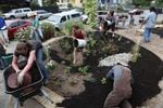 Washington state's permits promote low-impact development and installing things like rain gardens to absorb runoff. This rain garden was built by a West Seattle community group in 2011.
