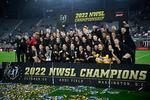 The Portland Thorns pose with the trophy after the team won the National Women's Soccer League championship match against the Kansas City Current on Saturday in Washington, D.C. Portland won 2-0.