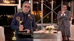 Eugene Levy accepts his award for lead actor in a comedy series for <em>Schitt's Creek </em>as his son (and creative partner) Dan Levy looks on at Sunday night's Emmy Awards.