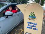A voter drops off a ballot in a drop box in Portland, Ore., on Election Day, Tuesday, Nov. 8, 2022. 