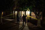 Ed Byrne, Homeland Security investigations agent, left, and Lt. Ken Impellizeri of the San Diego Police leave the scene of a fatal fentanyl overdose by a 39-year-old woman in San Diego, Calif., on Nov. 10.