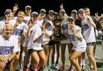 FILE - Vanderbilt posses with the trophy after their team won the NCAA's women's team tennis championships against Oklahoma, Tuesday, May 19, 2015, Waco, Texas. The number of women competing at the highest level of college athletics continues to rise along with an increasing funding gap between men’s and women’s sports programs, according to an NCAA report examining the 50th anniversary of Title IX.