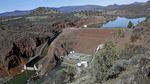 An aerial view of the Iron Gate Dam on the lower Klamath River on a sunny day.