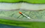 A syringe is seen in a tent near the intersection of Southwest 12th Avenue and Southwest Columbia Street in downtown Portland, June 25, 2021. 