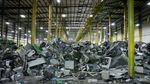 Plastics and metals from dismantled electronics await their turn to enter a machine that shreds and sorts them into commodity type.
